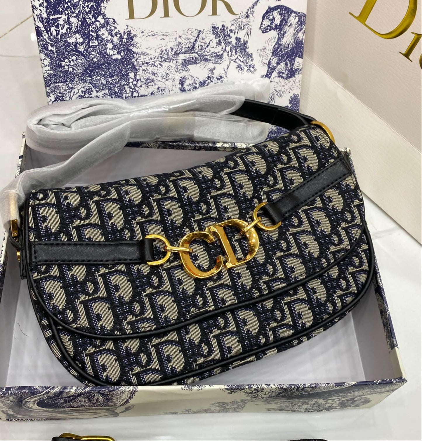 Black, brown, and patterned handbags with Di or logo on a neutral background