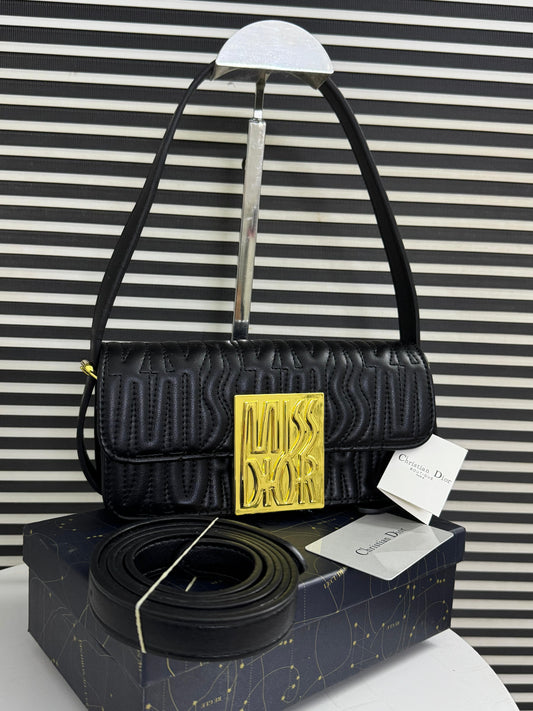 Black handbag with yellow tag on a striped background