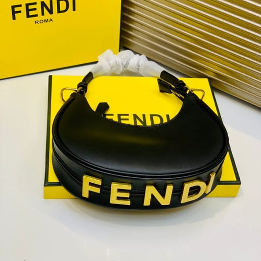 Fend i bag on a yellow Fen di box with a white background